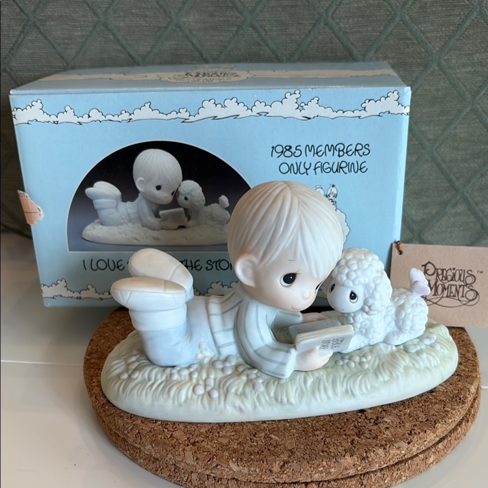 Precious Moments: “I Love To Tell The Story “. 1985 members only figurine.